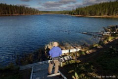 man bij meer; man at lake